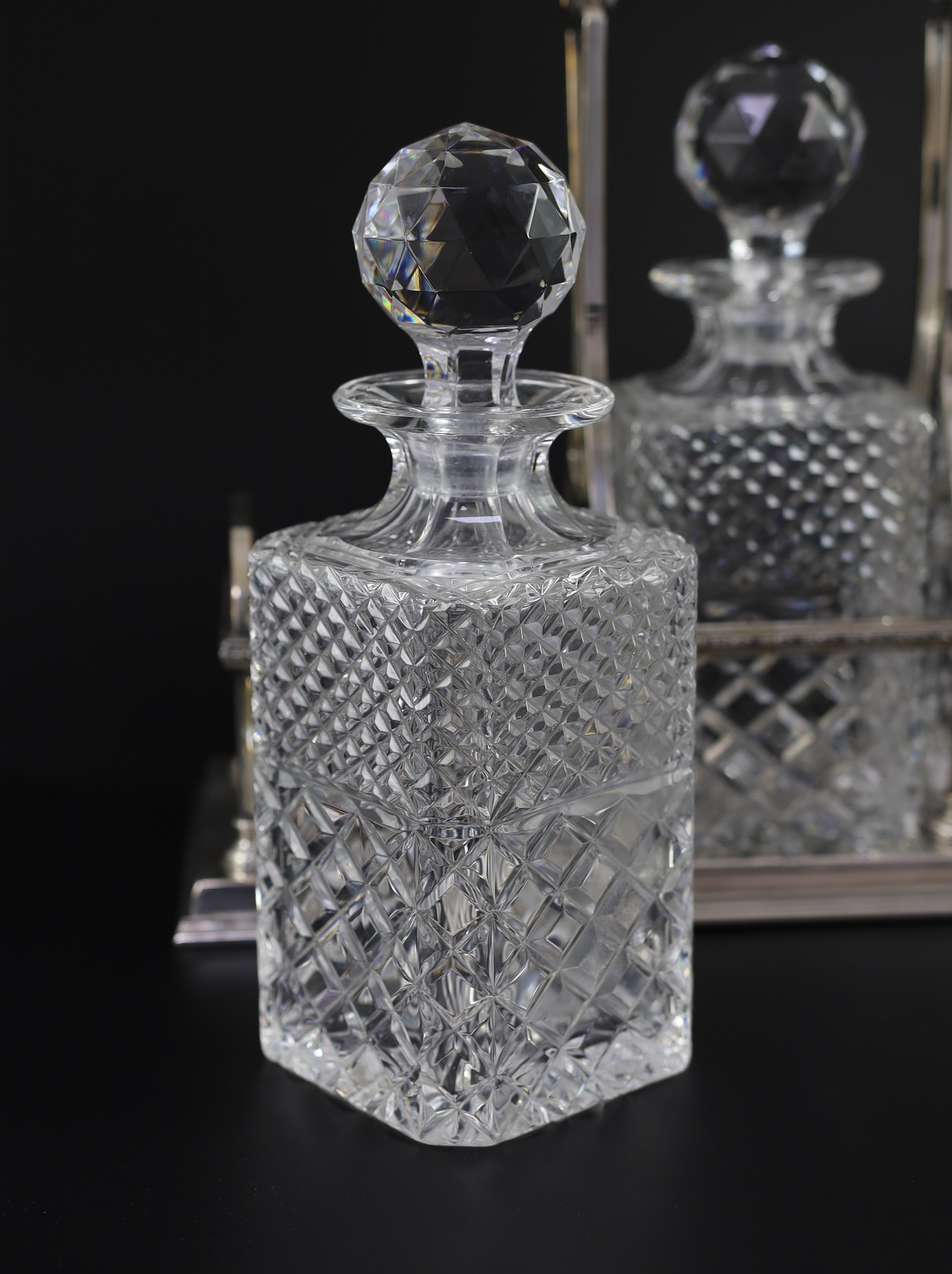 A modern silver three bottle rectangular decanter stand, by C.J. Vander Ltd